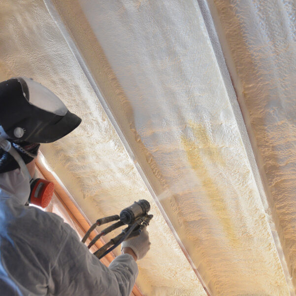 worker spraying the insulation